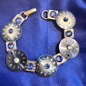 Bracelet made of vintage watch faces and crystals.